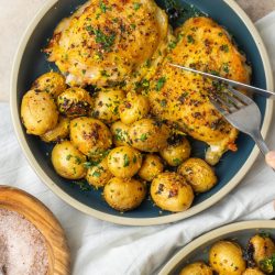 knife cutting into lemon pepper chicken thighs