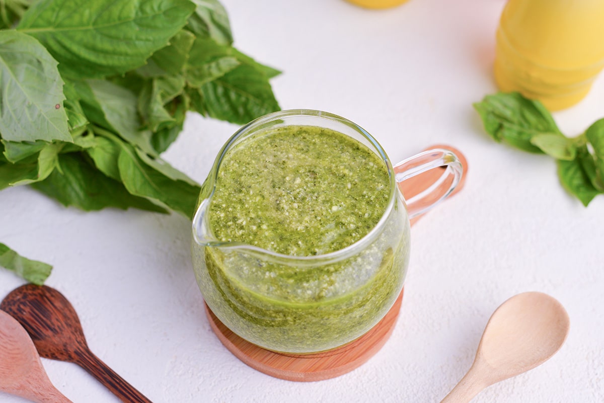 angled shot of basil pesto sauce