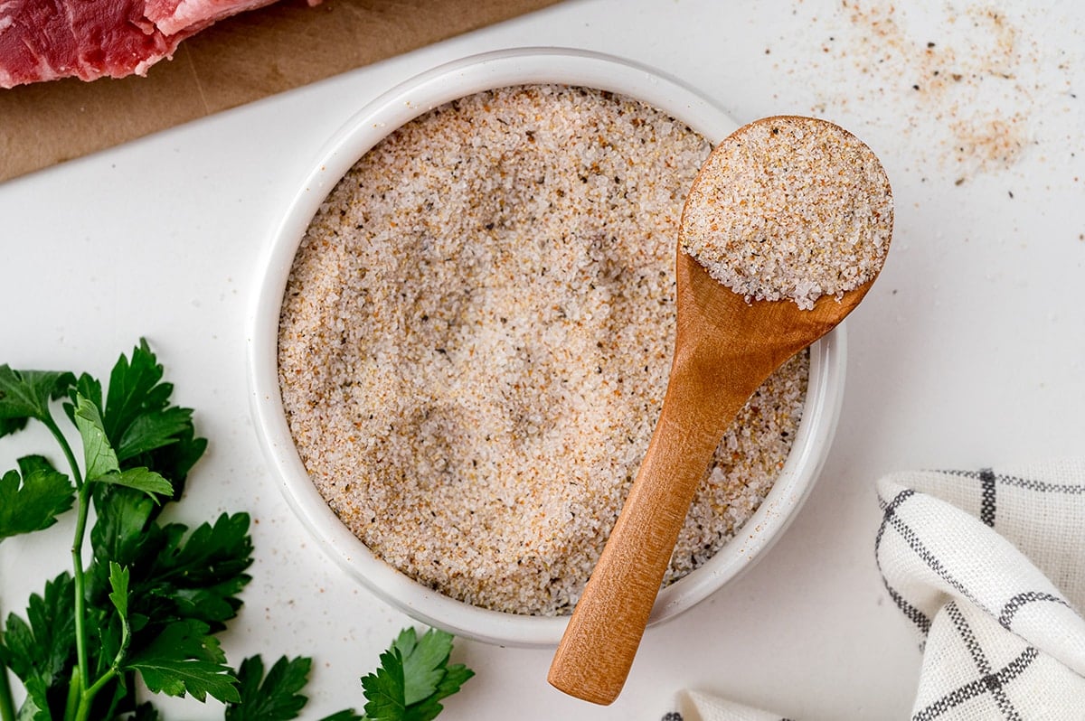 bowl of steak seasoning with wooden spoon