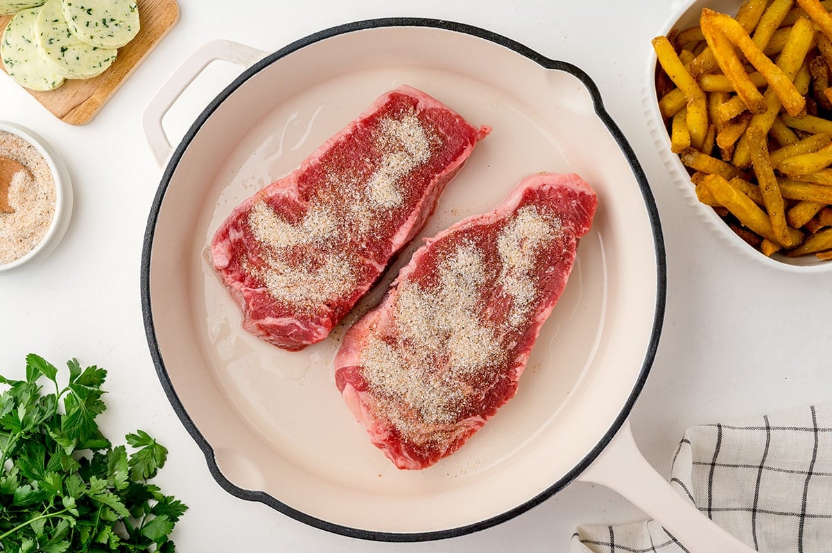 two steaks in a pan