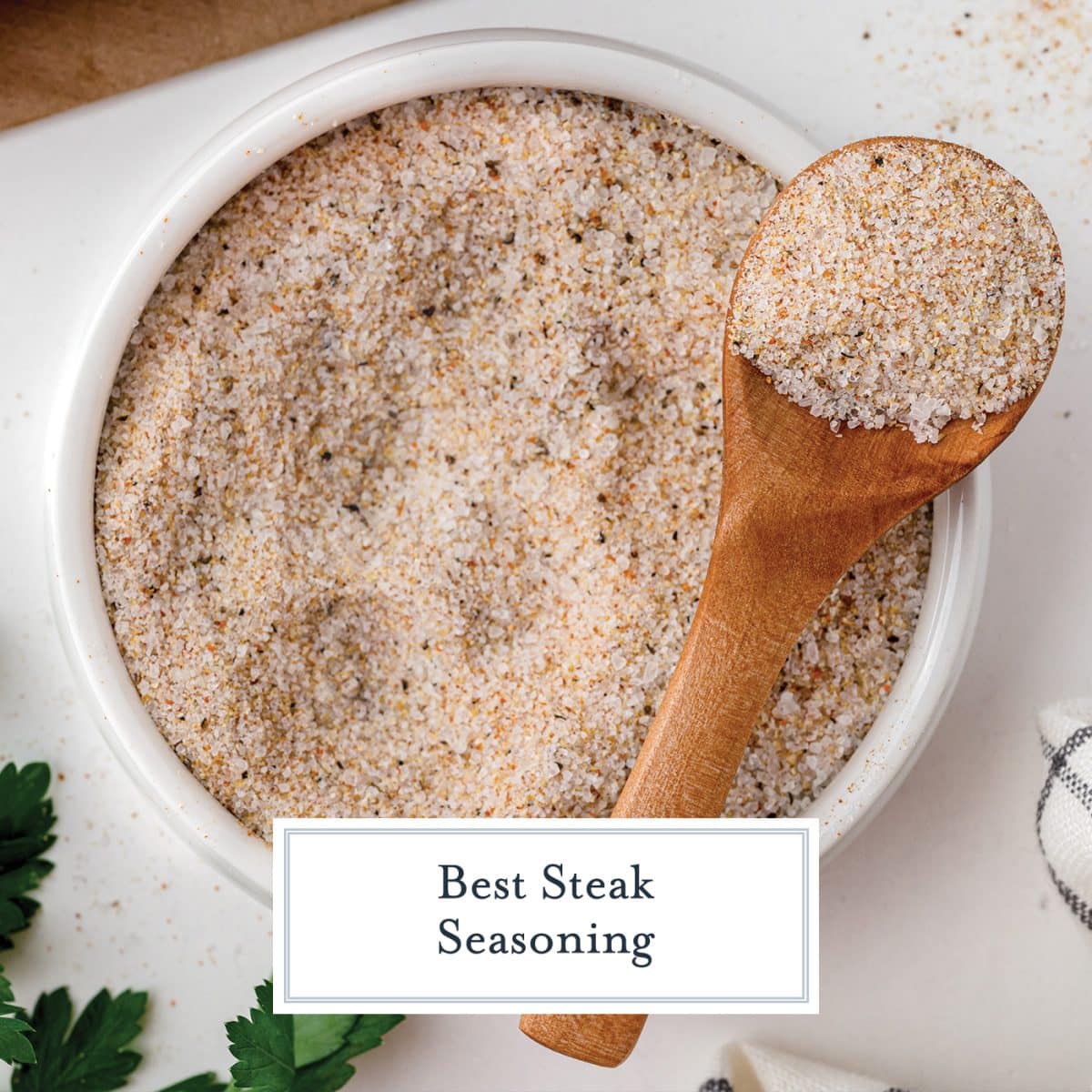 bowl of steak seasoning with wooden spoon with text overlay for facebook