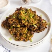 angled shot of broccoli fritters on a plate