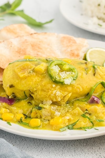 angled shot of plate of coconut chicken curry