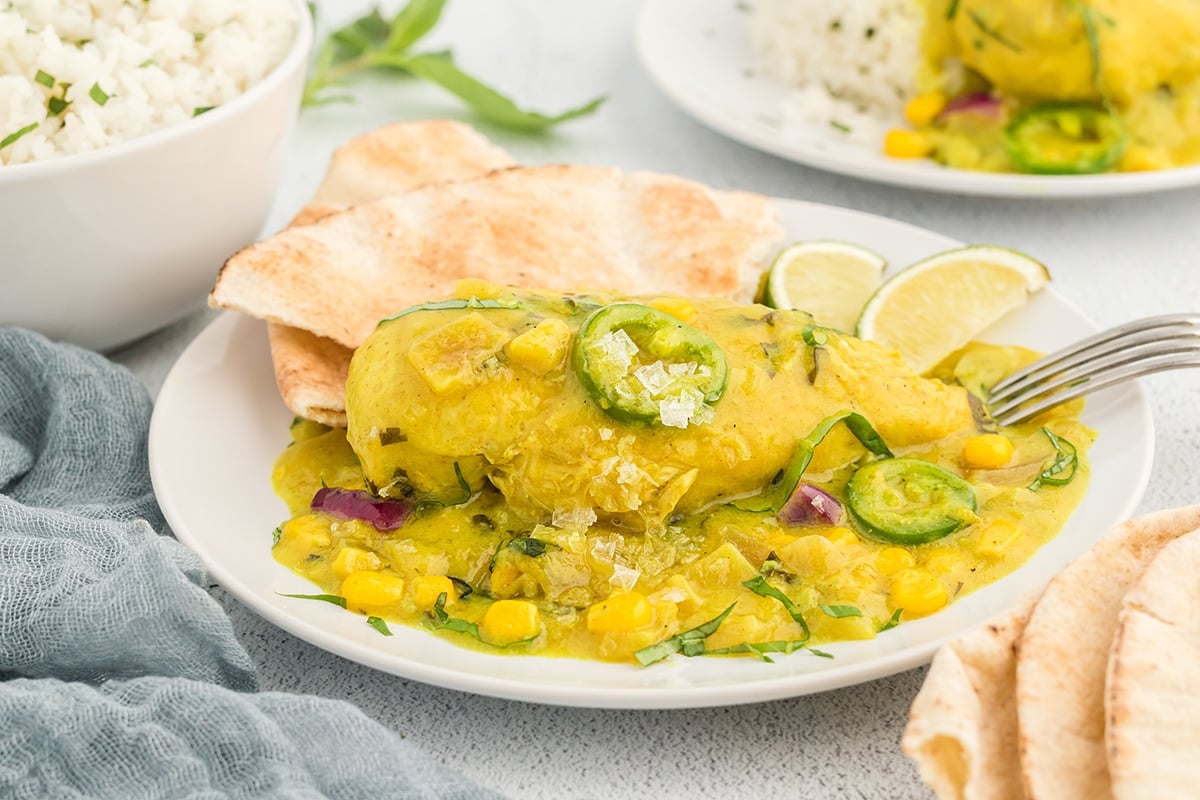 angled shot of plate of coconut chicken curry