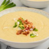 close up of leek and potato soup in a bowl