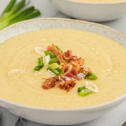 close up of leek and potato soup in a bowl