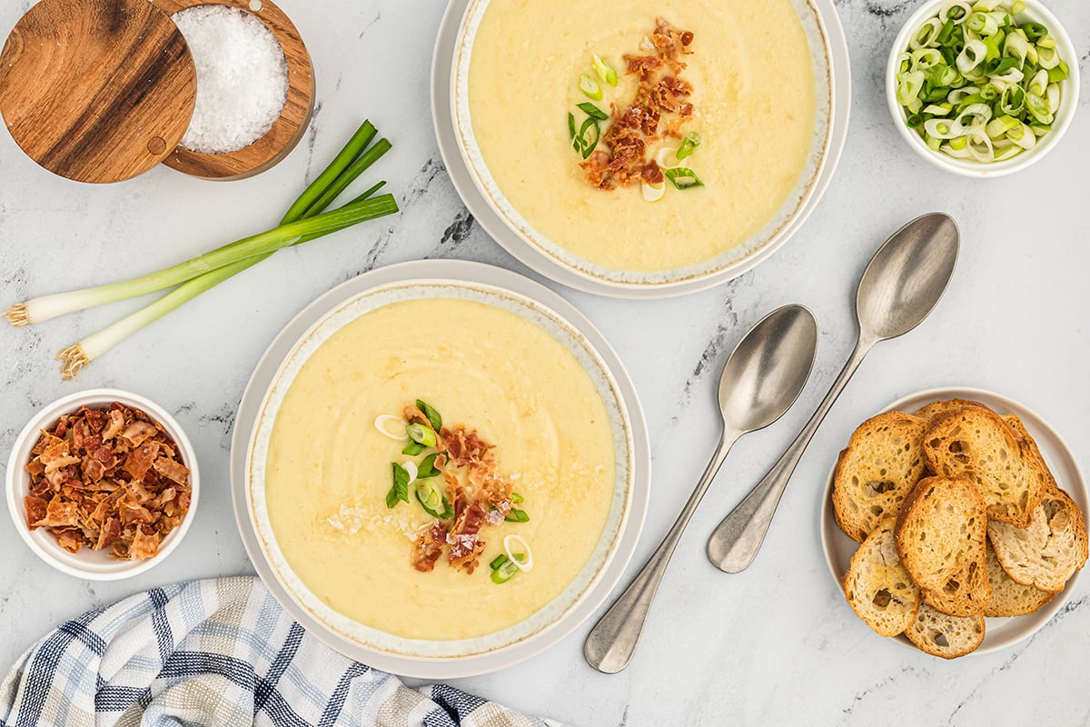 overhead shot of two bowls or leek and potato soup