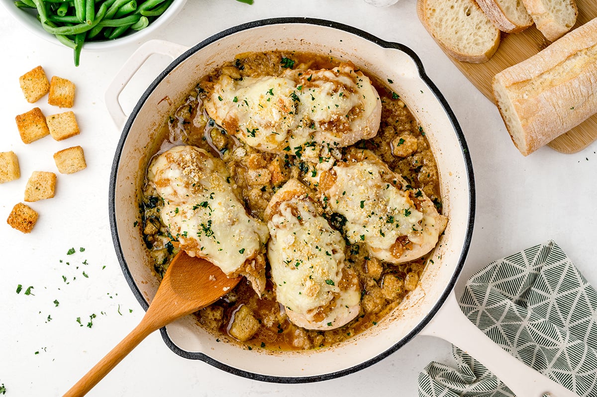 overhead shot of french onion chicken bake in a pan
