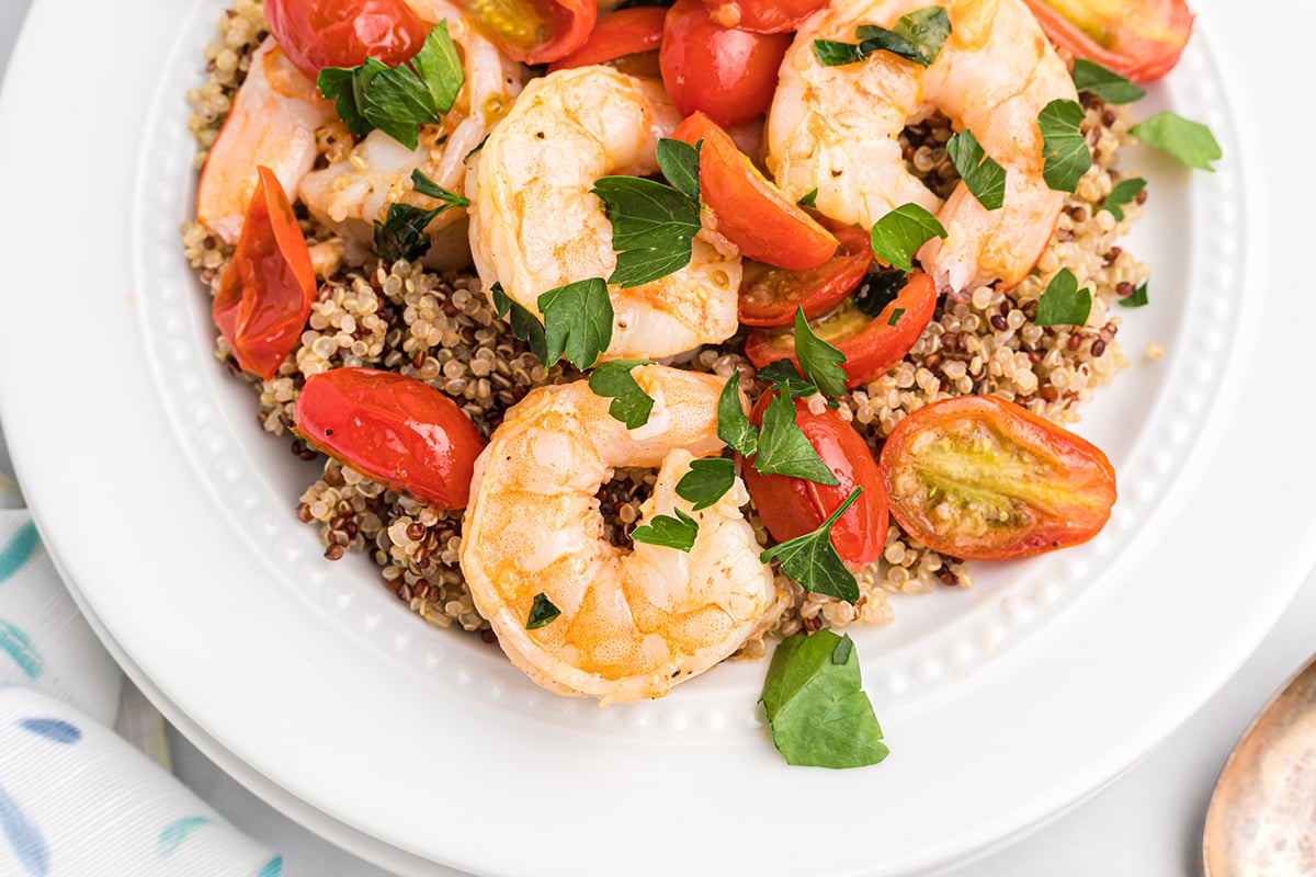 overhead of shrimp with tomatoes and quinoa 