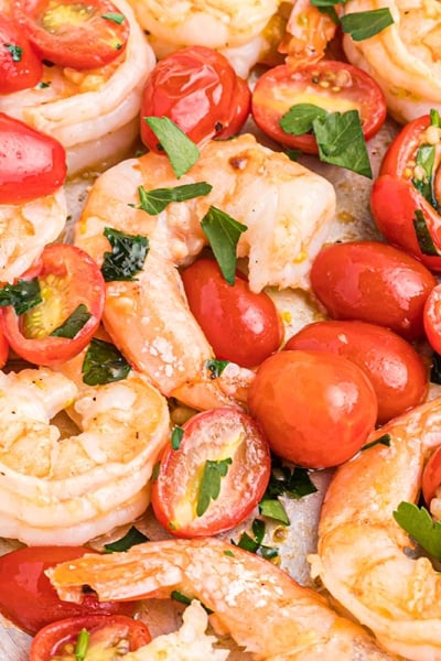 close up of garlic butter shrimp with tomatoes