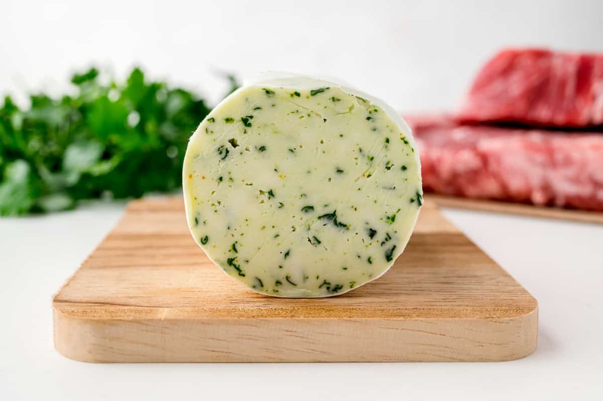 sliced maitre d hotel butter on a cutting board