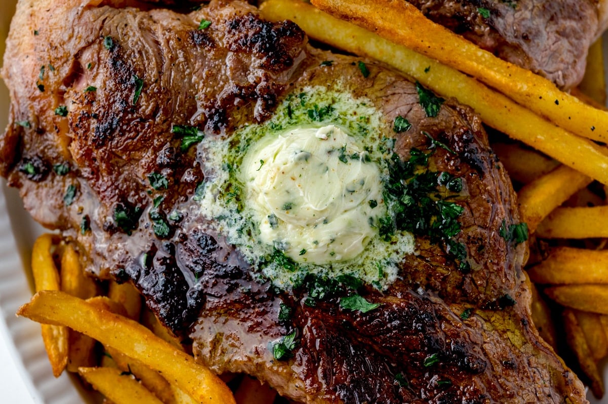 melted compound butter on a steak