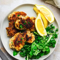 marinated grilled chicken thighs on plate