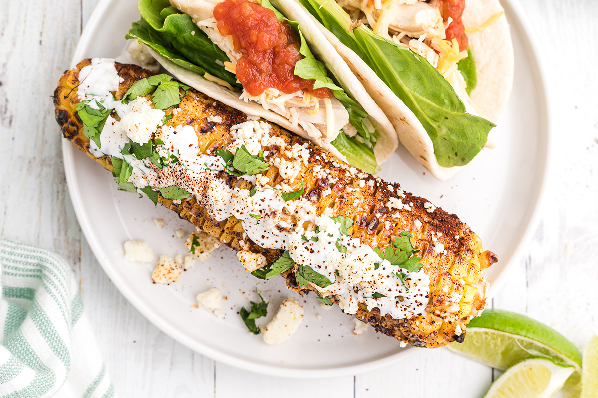 overhead shot of elotes on a plate