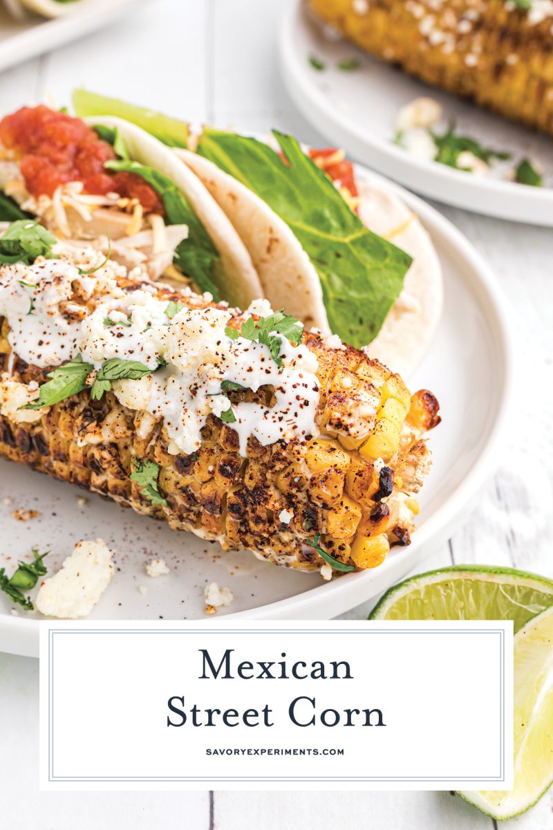 mexican street corn on a plate with tacos with text overlay for pinterest