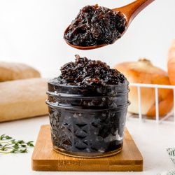 spoon scooping onion jam out of jar