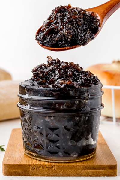 spoon scooping onion jam out of jar