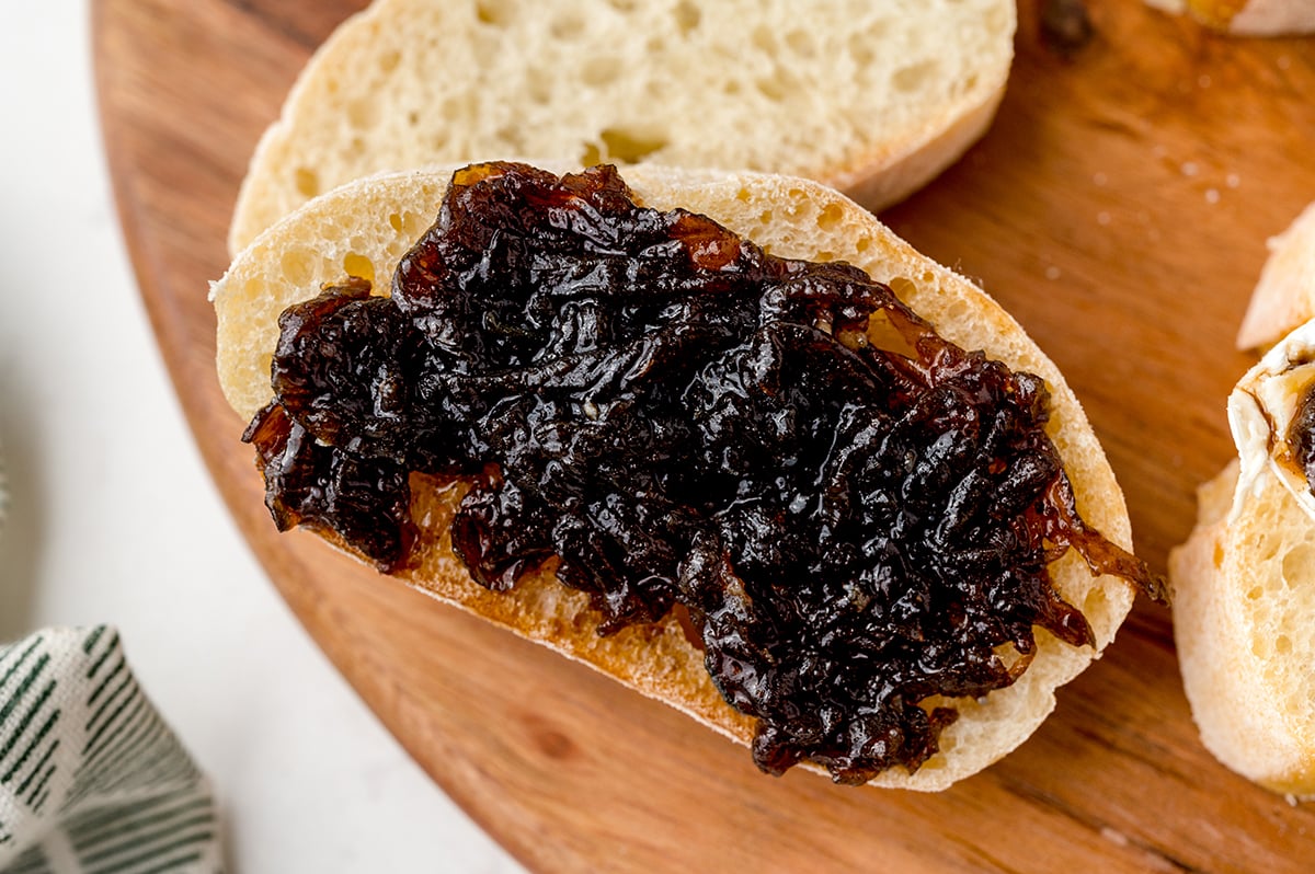 close up of onion jam spread on bread slice