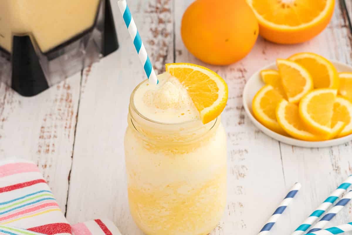 orange slice and straw in orange julius