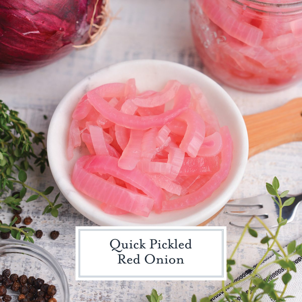 angle of pickled red onion in a small white marble bowl  