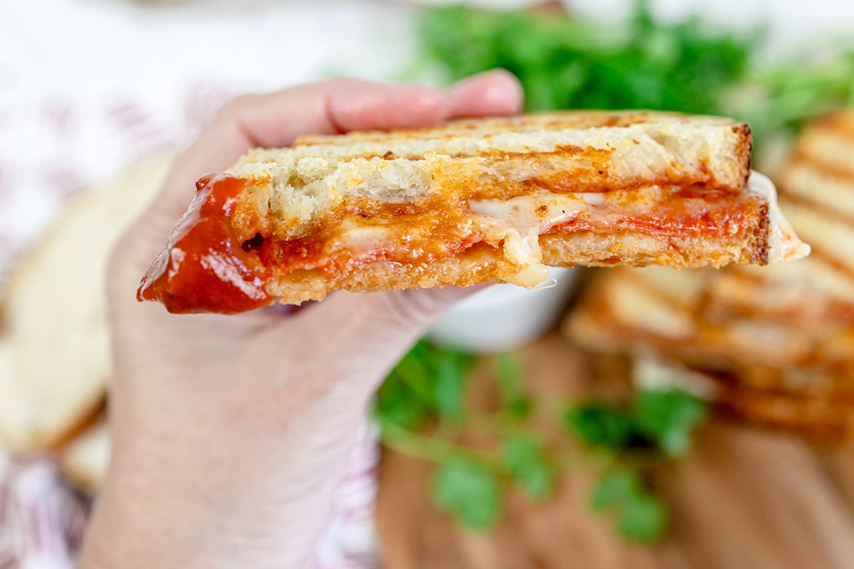 straight on shot of sliced pizza sandwich
