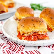 three pizza sliders on a plate