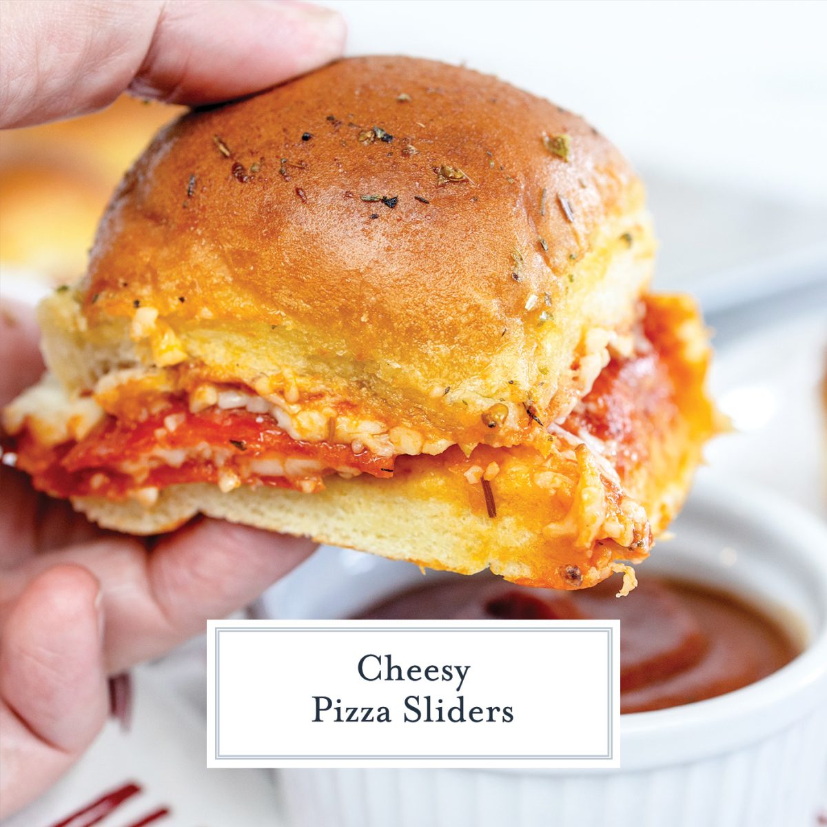 hand holdinf pizza slider with text overlay for facebook