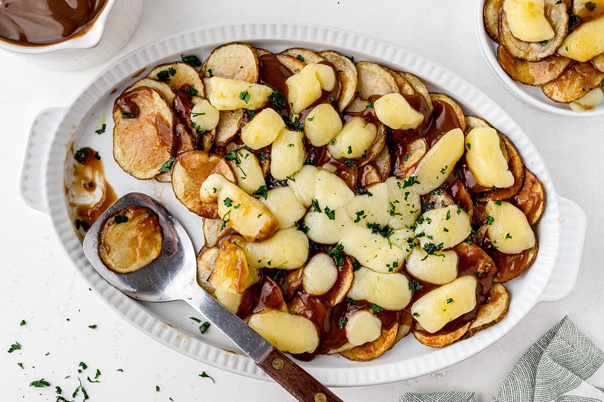 overhead of poutine in a casserole dish 