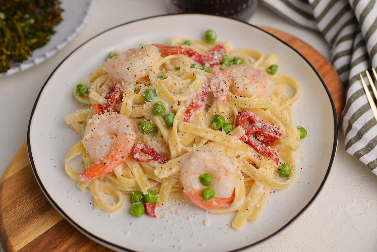 angle of shrimp alfredo on a white plate 