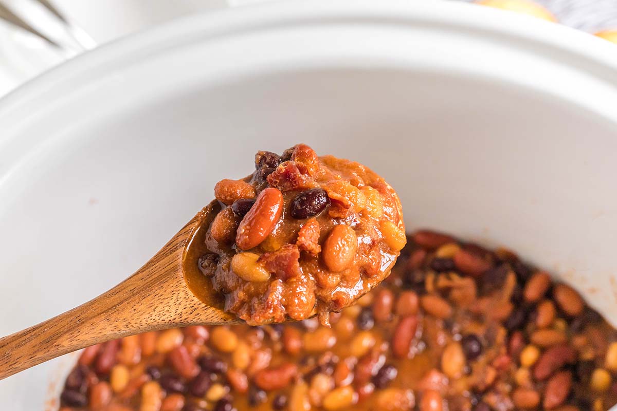 wooden spoon with baked beans