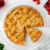 overhead shot of peach pie with slice taken out