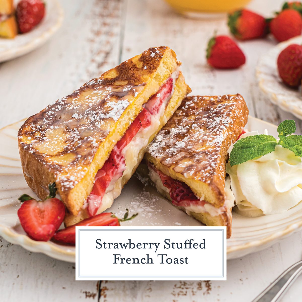 close up of strawberry stuffed french toast with syrup and fresh strawberries 