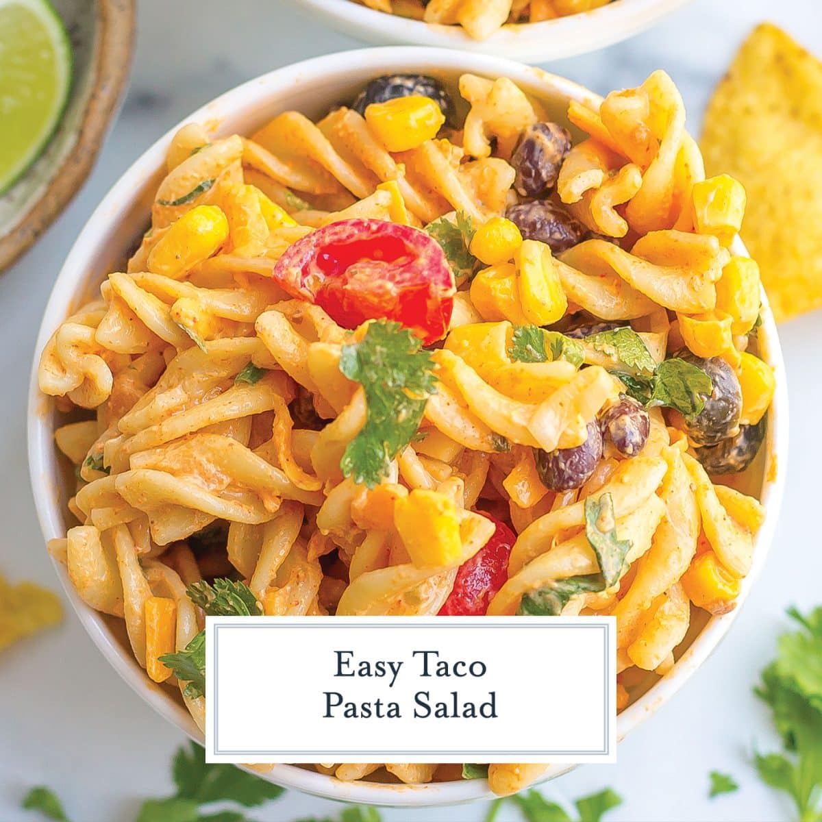 overhead shot of bowl of taco pasta salad with text overlay for facebook