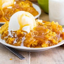 close up of dump cake with scoop of vanilla ice cream