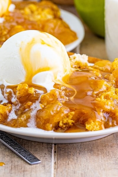 close up of dump cake with scoop of vanilla ice cream