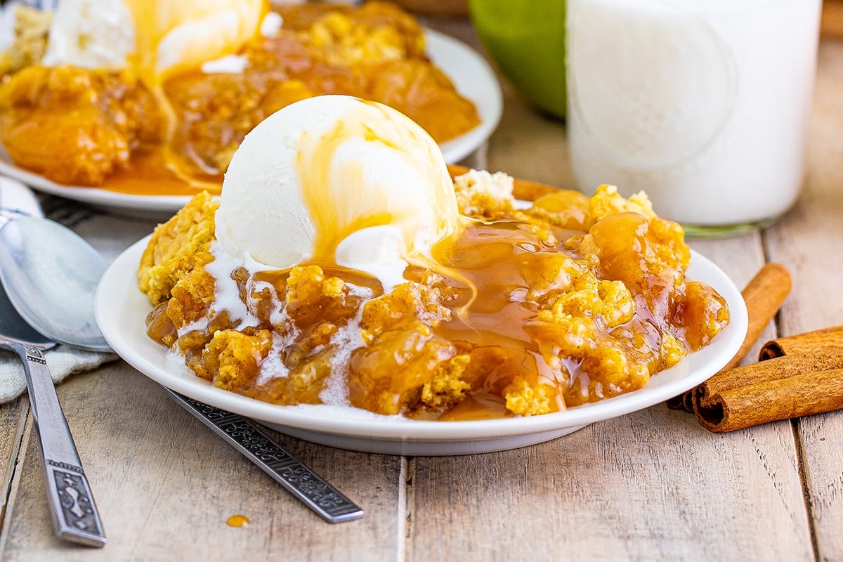 close up of dump cake with scoop of vanilla ice cream