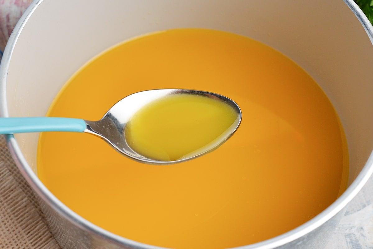 clarified butter in a spoon
