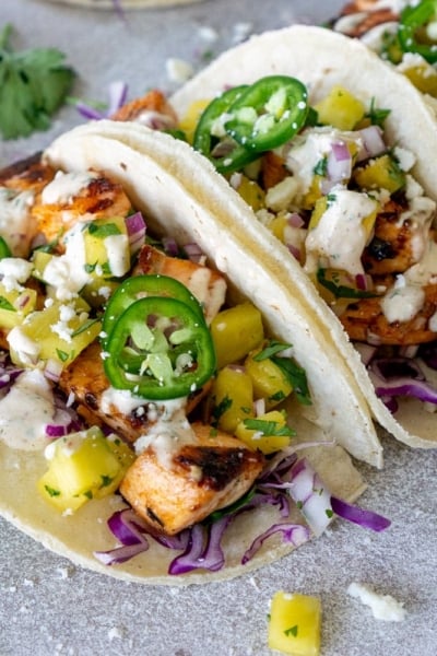 angled shot of three fish tacos