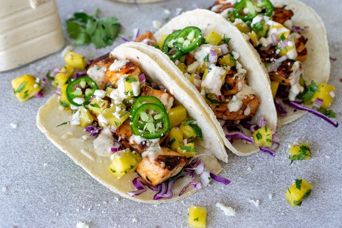 angled shot of three fish tacos