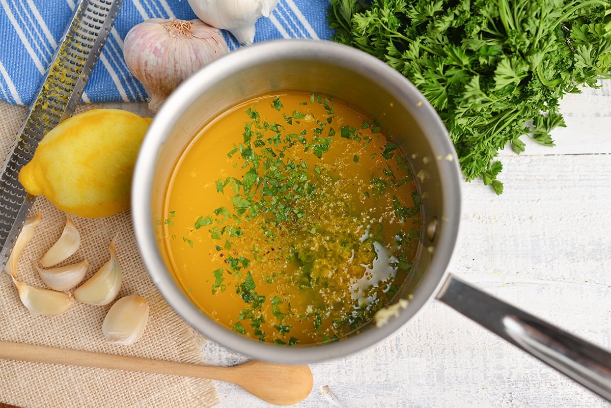 overhead of garlic butter sauce in a small saucepan