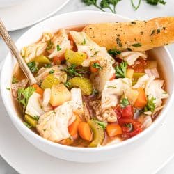 bowl of cabbage soup with breadstick