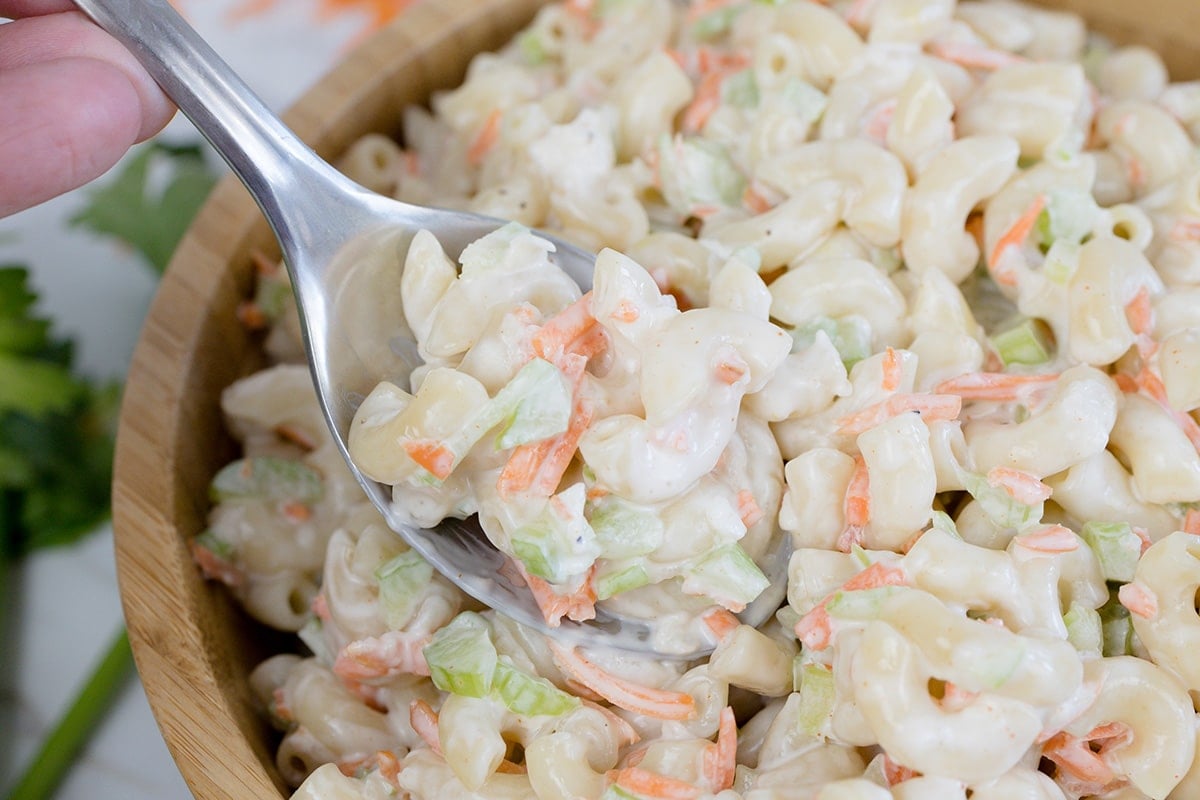 spoon in bowl of macaroni salad