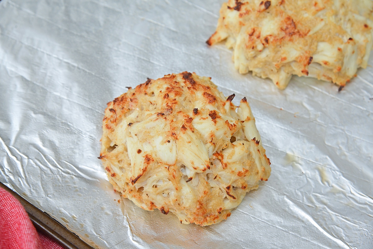 all meat, little filler crab cake on a lined baking sheet
