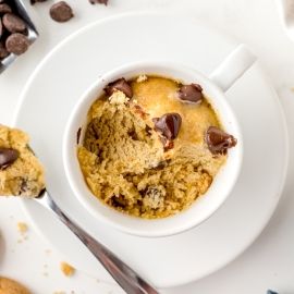 scoops taken out of a mug cookie