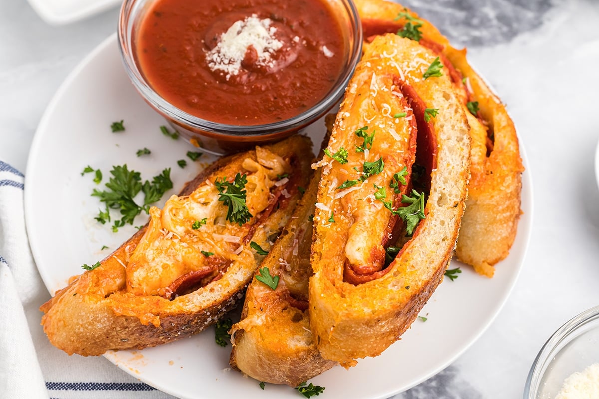 slices of pepperoni stromboli on plate