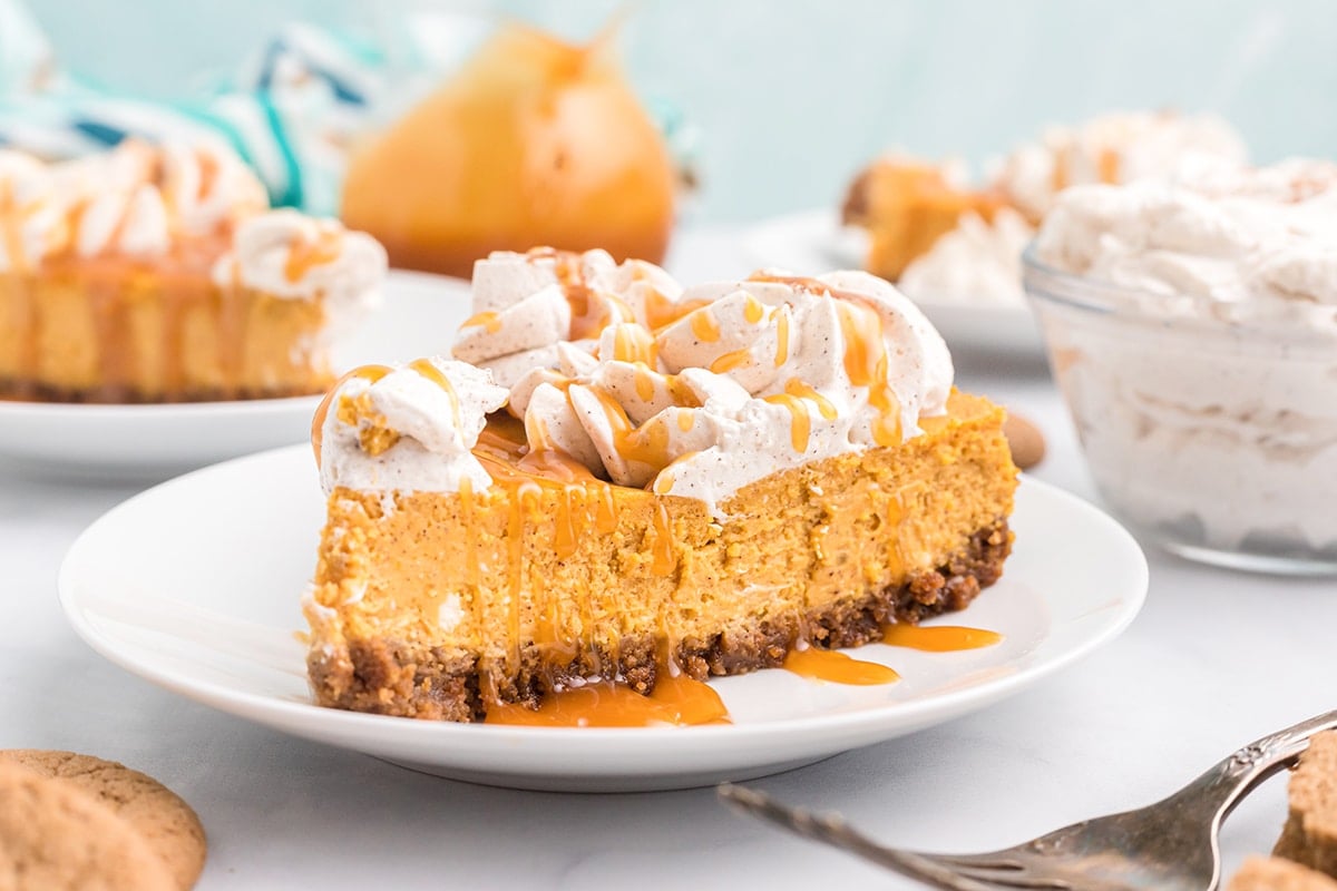 slice of pumpkin pie cheesecake on a white serving plate