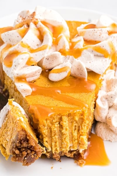 fork taking a bite of pumpkin cheesecake