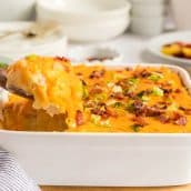 spoon in dish of twice baked potato casserole