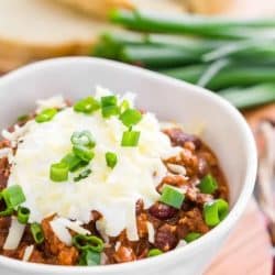 bowl of turkey chili with cheese and sour cream