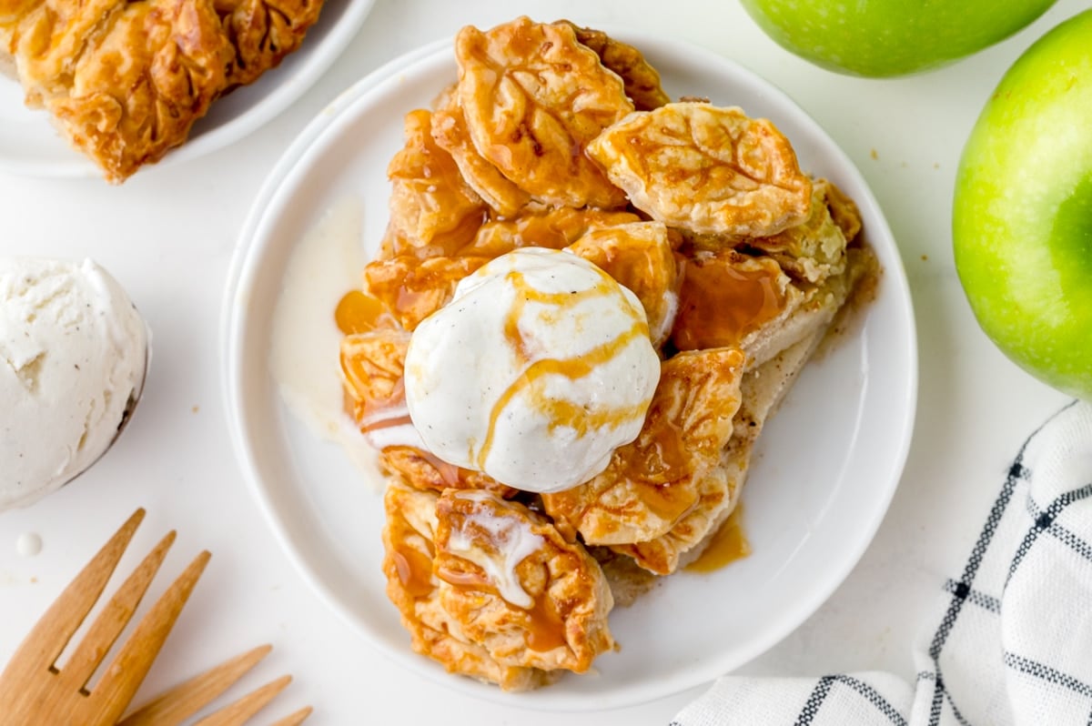 overhead shot of slice of apple pie with vanilla ice cream